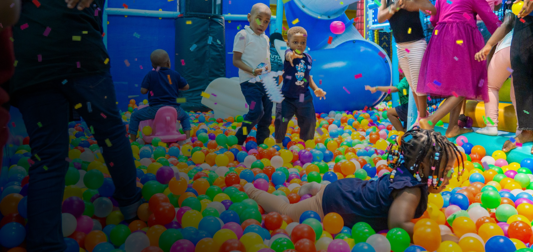 Kids playing in a colourful ball pit