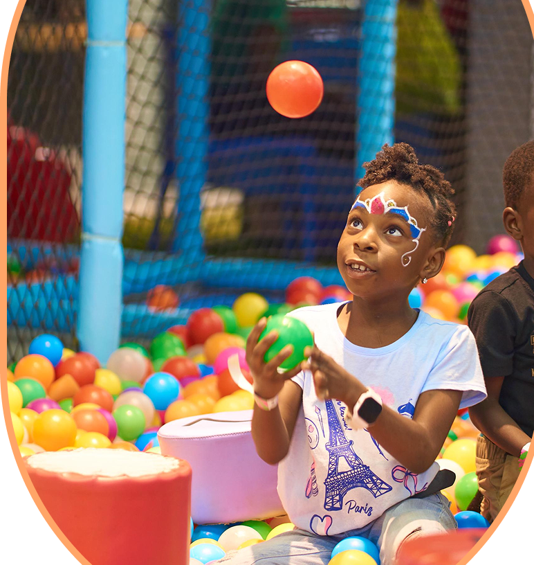 Child playing in ball pit