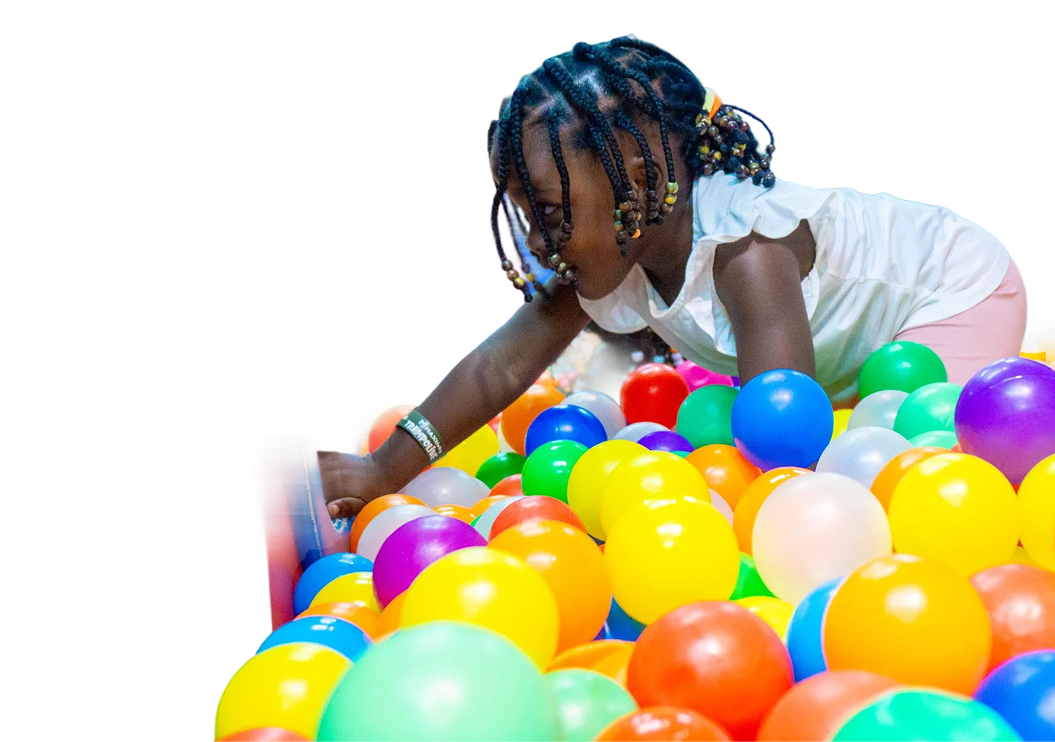 Child playing in ball pit